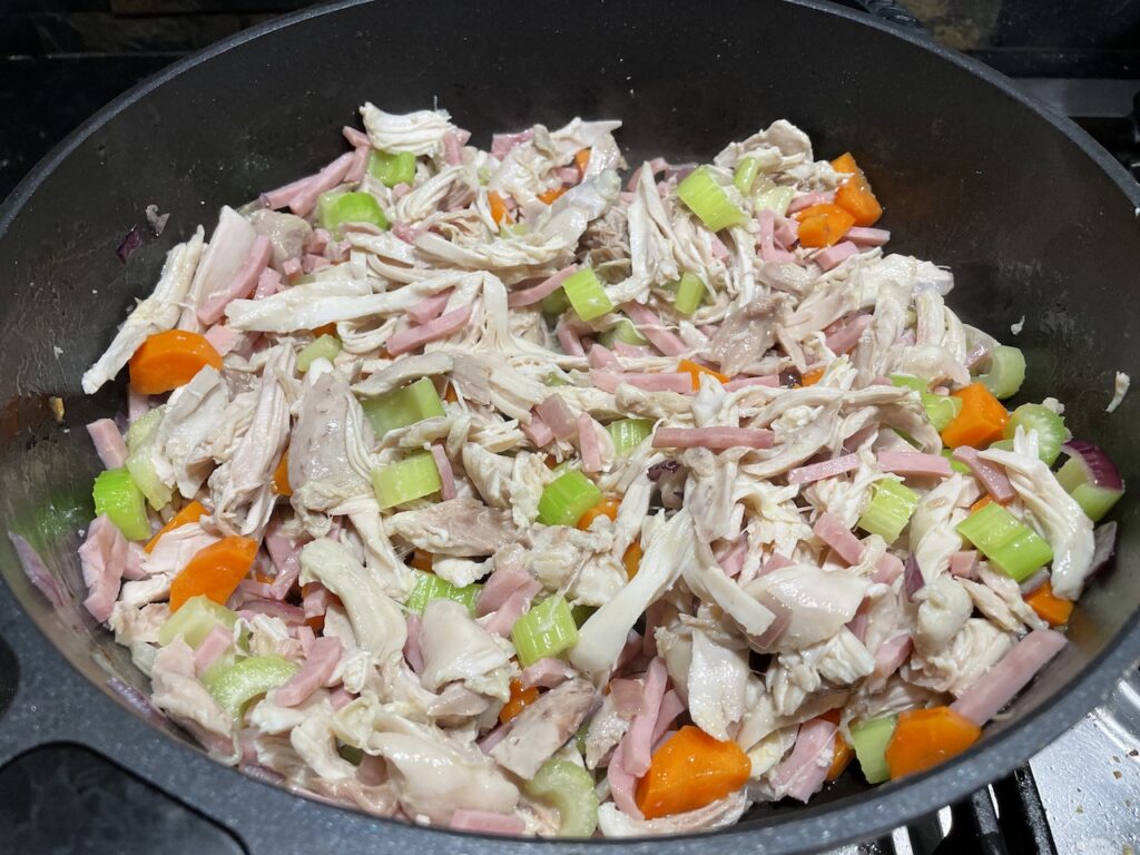 Combined Ingredients in pan. Chicken - carrots - Ham and Celery