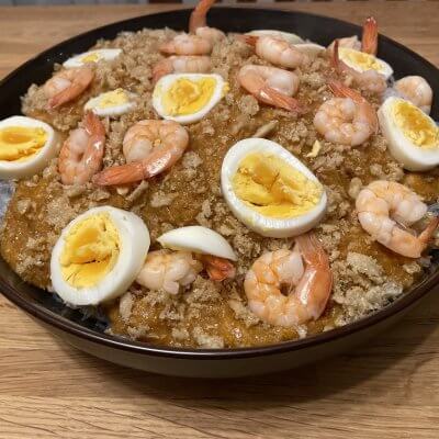 Palabok Recipe On Top Of Noodles Chicharron Dressing Egg and shrimp