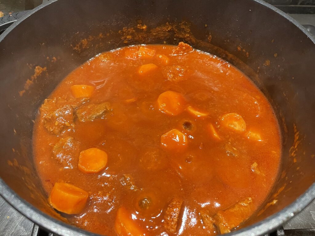 Add carrots to Beef Pochero Sauce and let it simmer