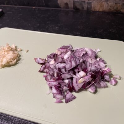 Cut the onions and garlic for this Taco Recipe