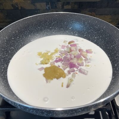 Onions - garlic, Coconut milk and Ginger in Wok for Bicol Express Recipe