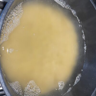 Boiling Macaroni in big pan on stove