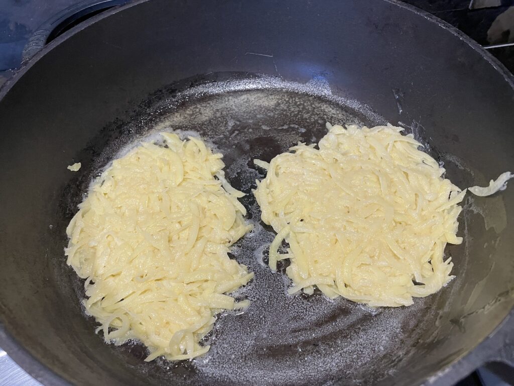 Butter in pan for cooking Potato Pancakes