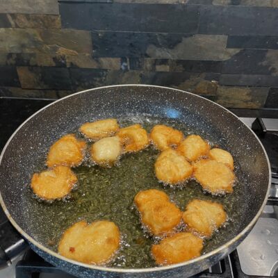 Fry the fish balls until golden brown.