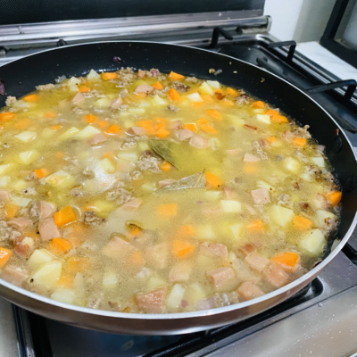 Add Water to the Pork and Vegetables for Pork Giniling Recipe